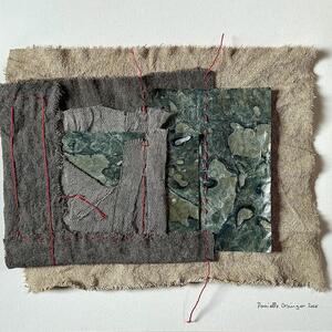 Textile collage of grey and natural-coloured fabric with blue-green marbled paper, crossed by red stitching.