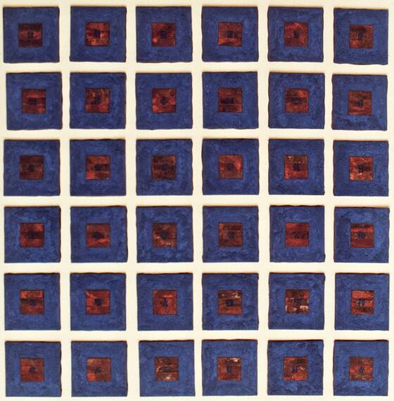 Grid of 36 blue squares, each with a rusty field at its centre.