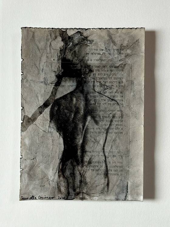 Body outline in black ink on crumpled paper with writing.