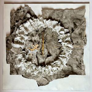 Ring of crumpled, written-on paper on a grey ground, with two small golden figures and a golden line in the centre.